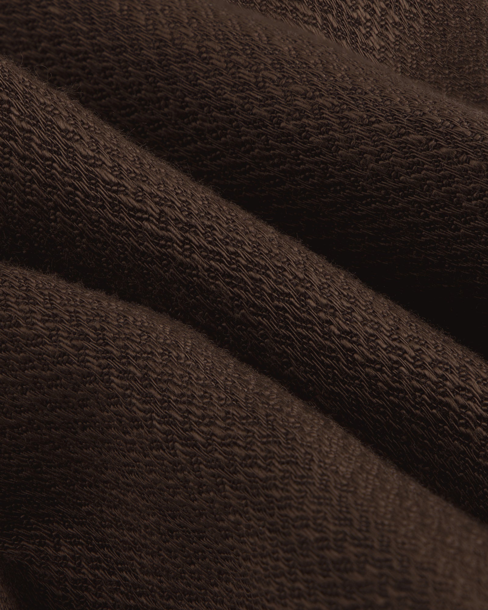 Close-up of folded Linen Blend Suit Trouser, highlighting its textured surface and weave pattern.