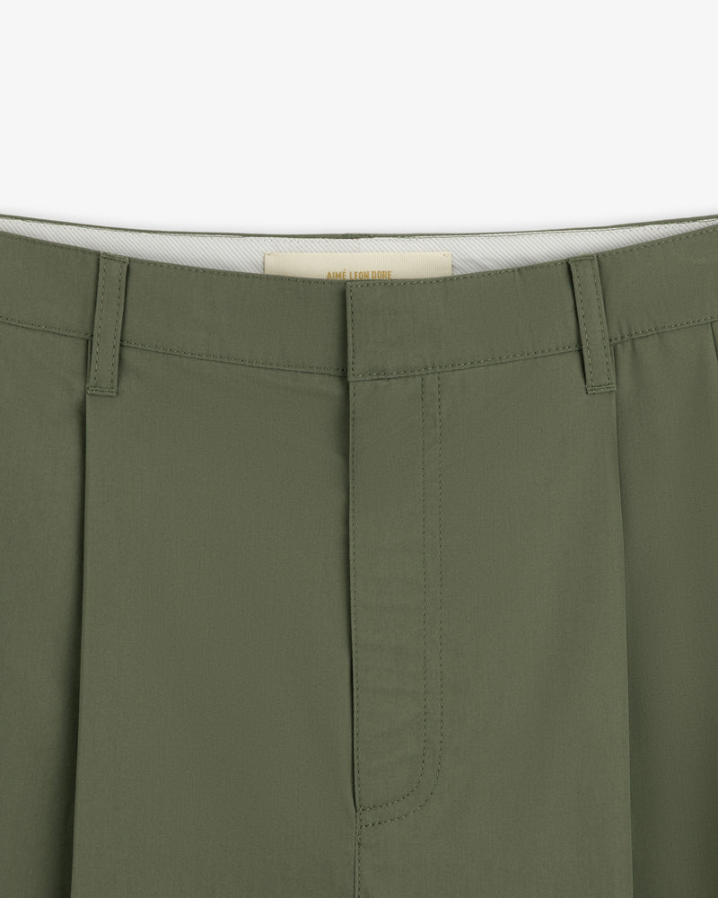 Close-up of the waistband and fly of Lightweighted Pleated Cotton Trouser with belt loops and visible stitching.