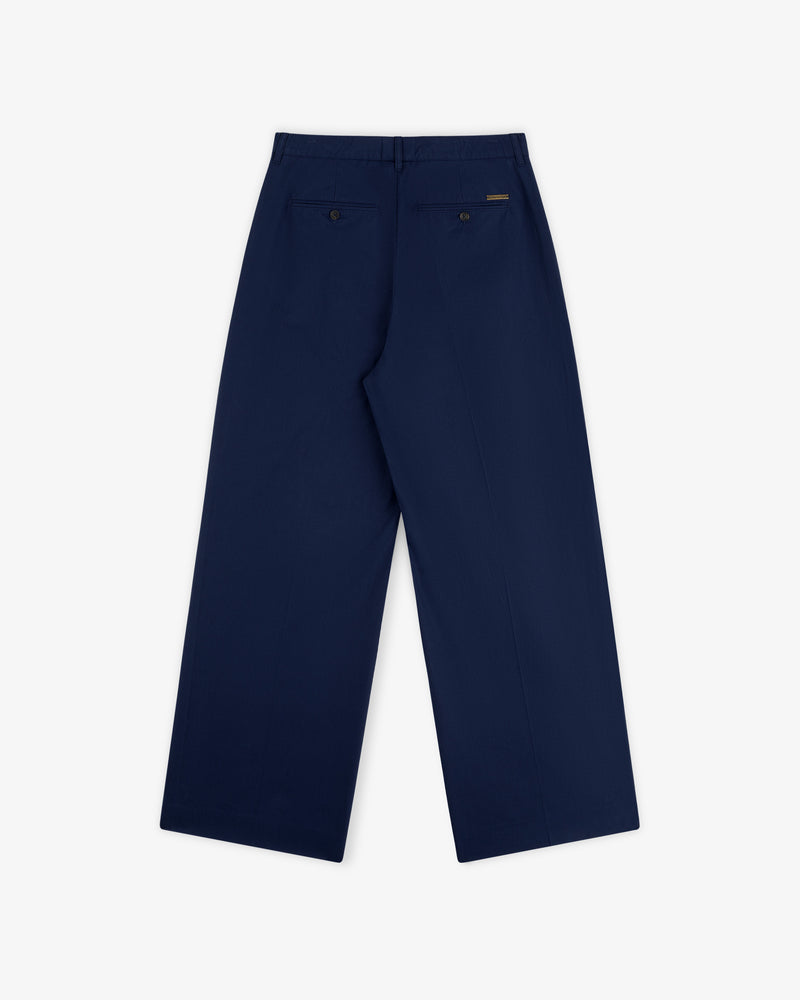 Lightweighted Pleated Cotton Trouser in navy blue, wide-leg style with two buttoned welt back pockets.