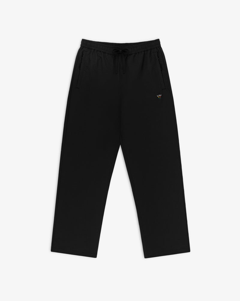 Crest Nylon Track Pant: Black drawstring pants with side pockets, straight legs, and a small crest logo on the left thigh.