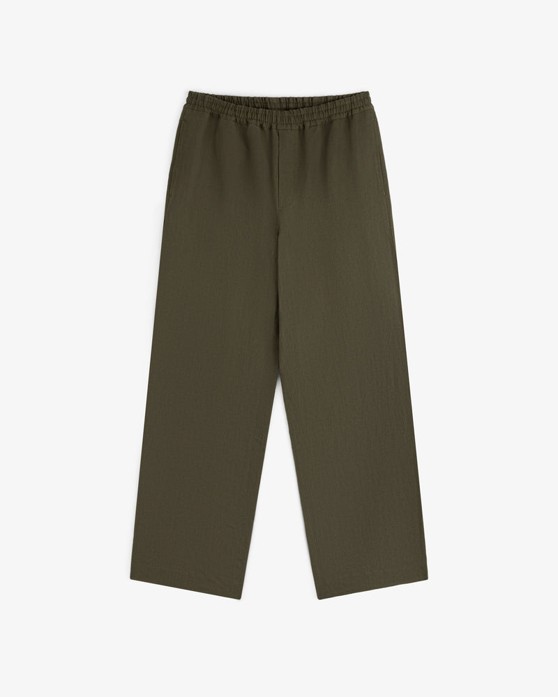 Linen Leisure Pant in olive green with wide legs and elastic waistband, shown laid flat on a white background.