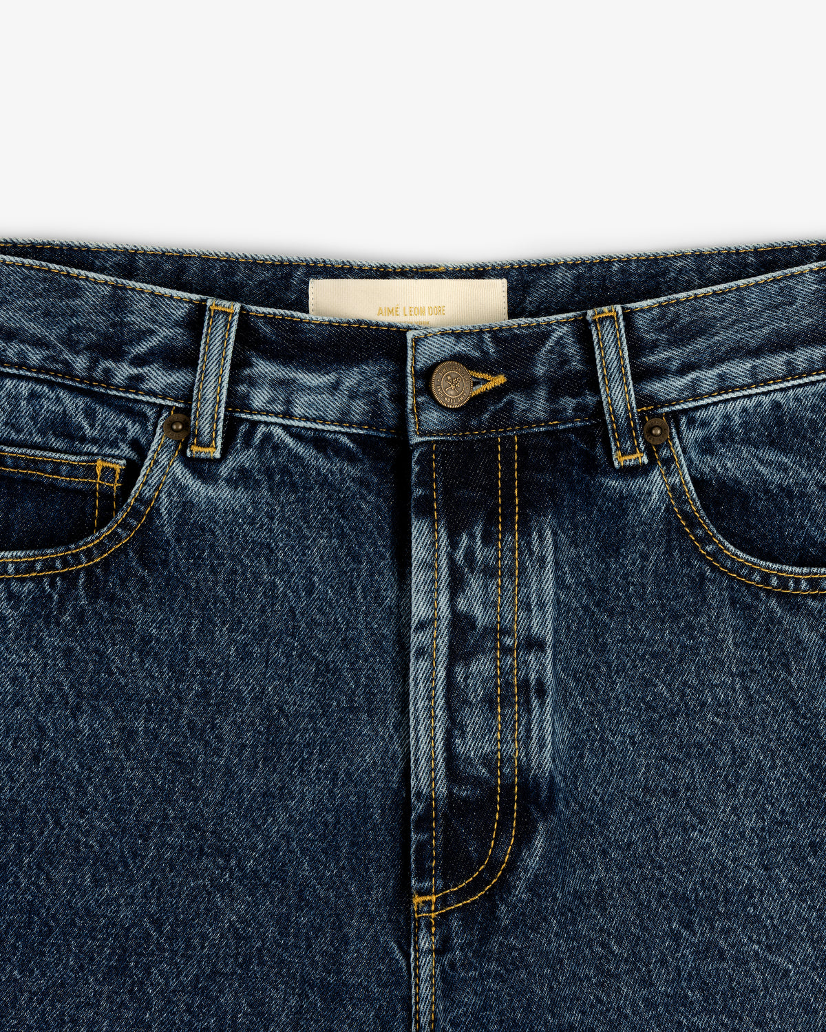Close-up of Relaxed Fit 5-Pocket Denim Pant with front pockets, button, zipper, and yellow stitching.