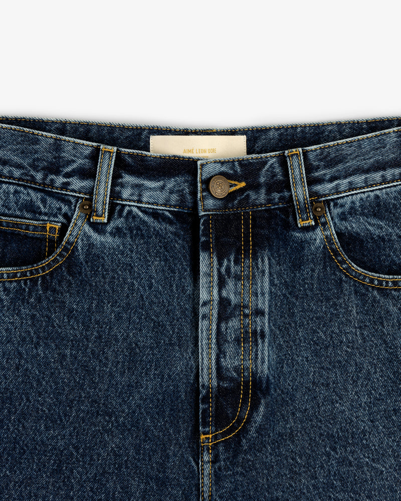 Close-up of Relaxed Fit 5-Pocket Denim Pant with front pockets, button, zipper, and yellow stitching.