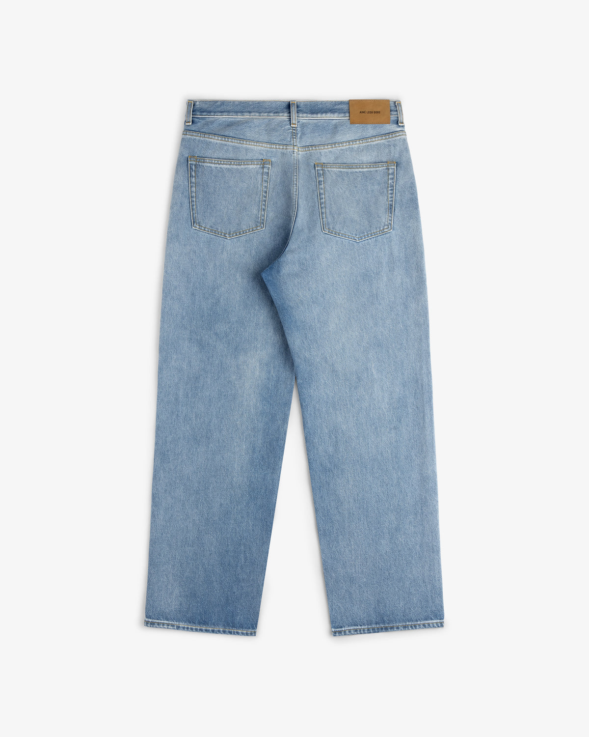 Back view of Relaxed Fit 5-Pocket Denim Pant in light blue, featuring two back pockets and a brown leather patch.