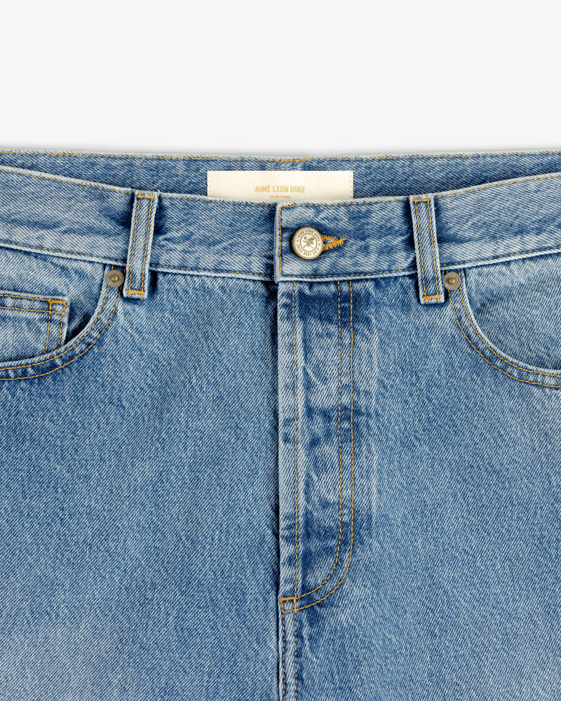 Close-up of the waistband and front pockets of ALD Straight Fit Denim featuring a metal button and belt loops.