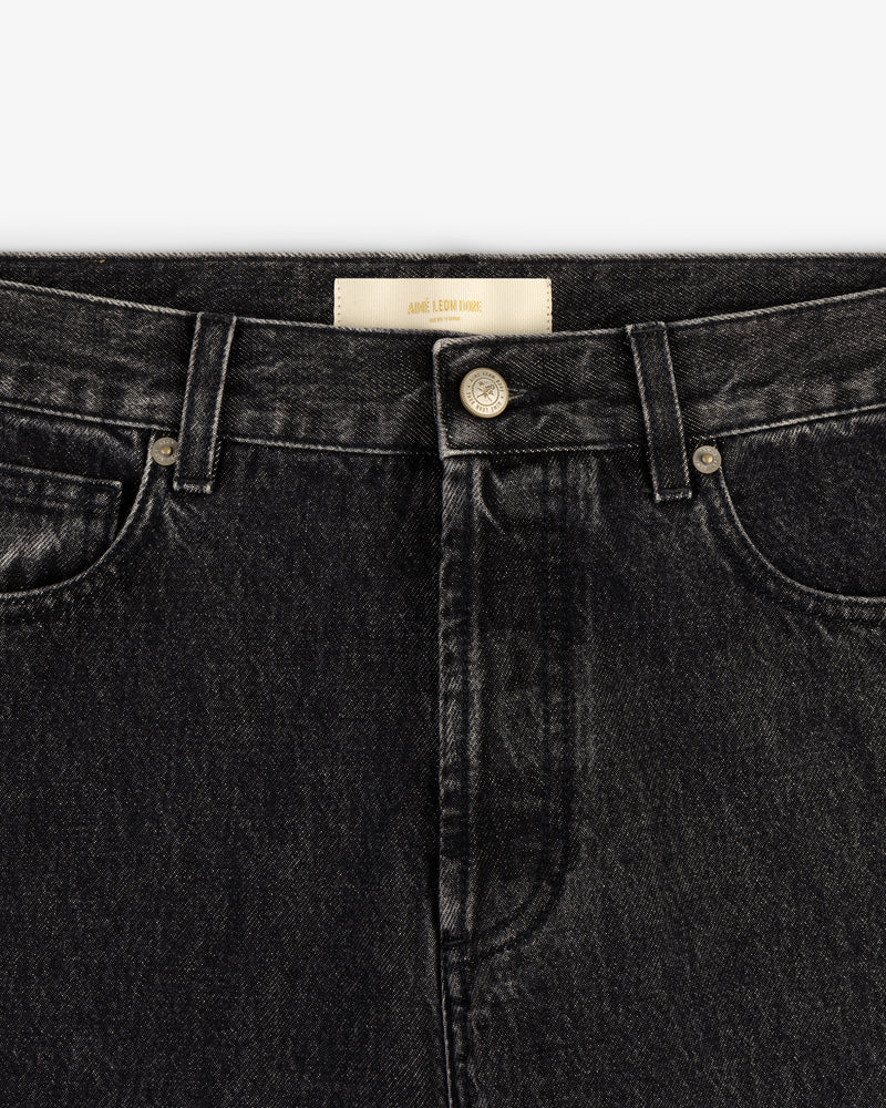 Close-up of waistband and front of Relaxed Fit 5-Pocket Denim Pant in black with metal button and belt loops.