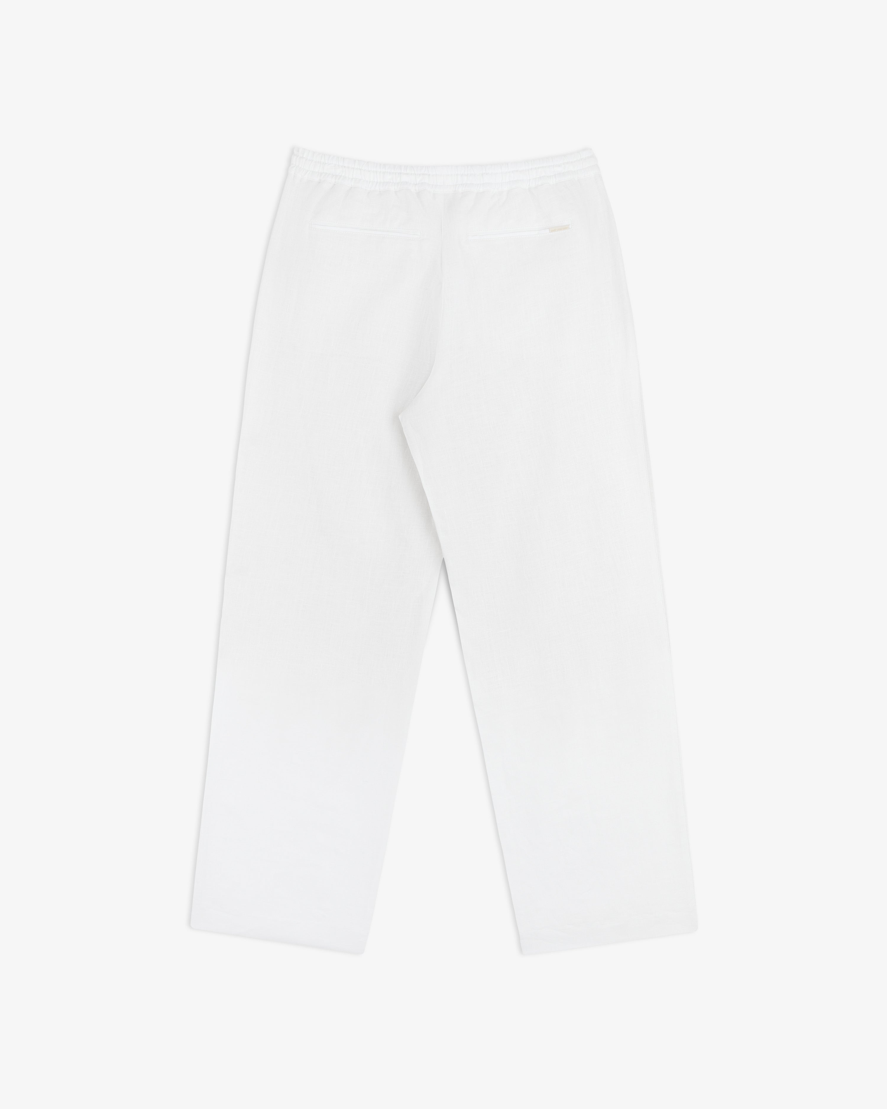 Linen Leisure Pant in white with straight legs, elastic waistband, and one back pocket on a white background.