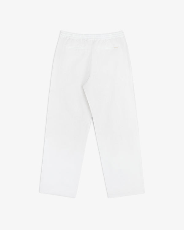 Linen Leisure Pant in white with straight legs, elastic waistband, and one back pocket on a white background.