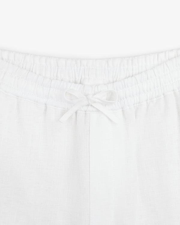 Close-up of the Linen Leisure Pant featuring an elastic waistband and a tied drawstring bow.