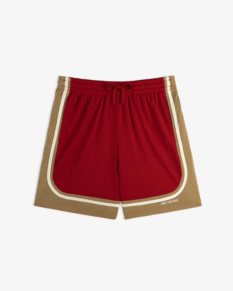 Colorblock Court Short: red and tan with white trim, drawstring waist, plus small text on the lower right leg.