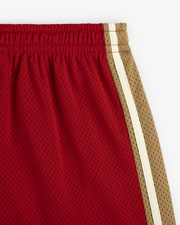 Close-up of Colorblock Court Short in red mesh with tan and white side stripes, shown on a white background.