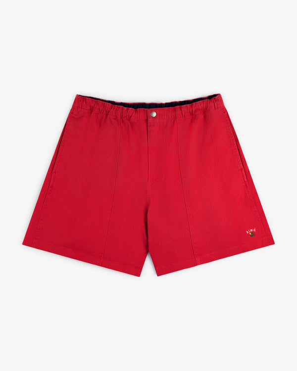 Crest Casual Short in red with elastic waistband, front button, and small embroidered logo on the lower left leg.