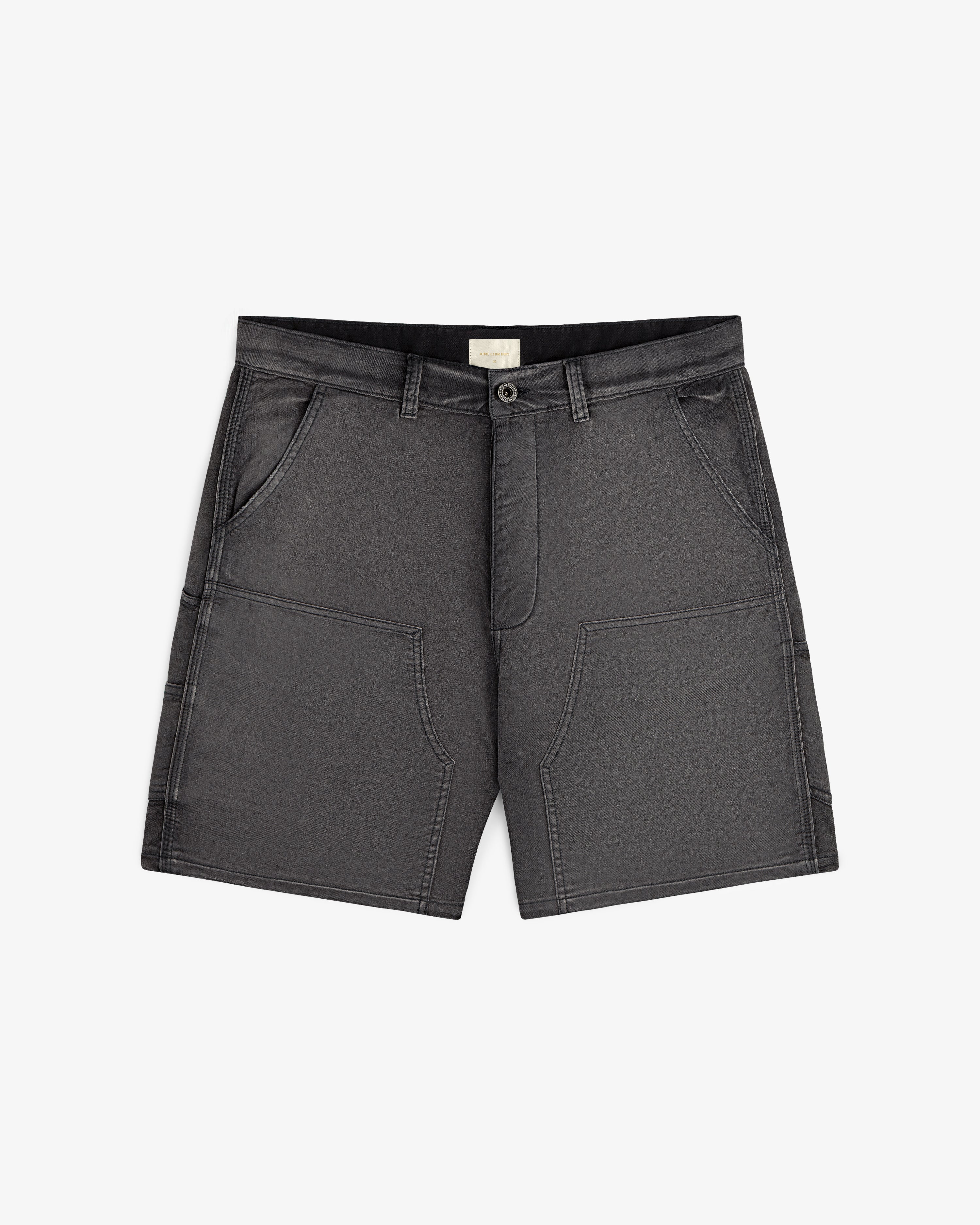 Garment Dyed Carpenter Short in dark gray with front pockets, belt loops, and a button closure, laid flat on white.