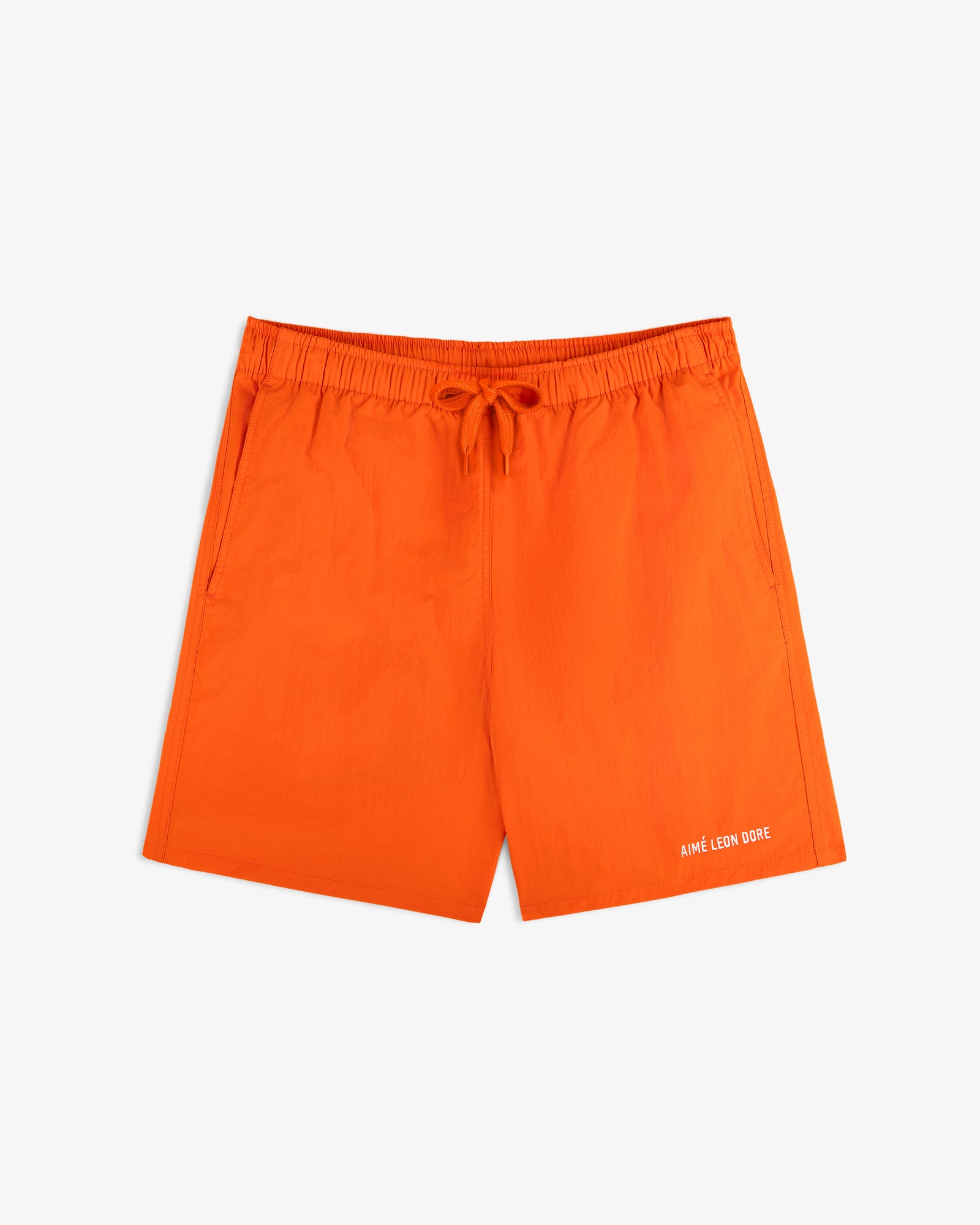 Bright orange Logo Swim Short with side pockets and white Aimé Leon Dore logo on the lower left leg.