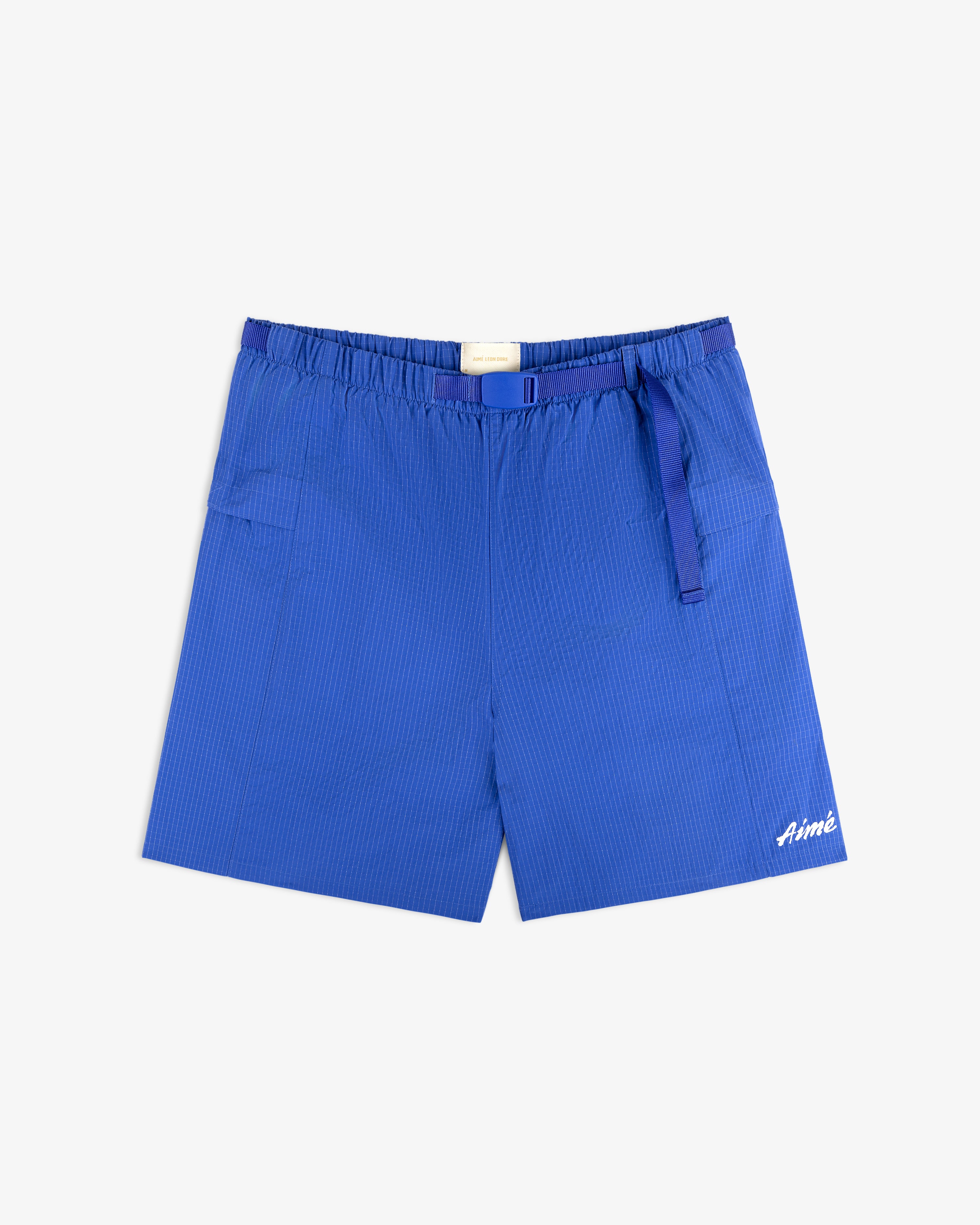 Ripstop Nylon Wave Short in blue with subtle pinstripes and Aimé embroidered in white on the lower left leg.