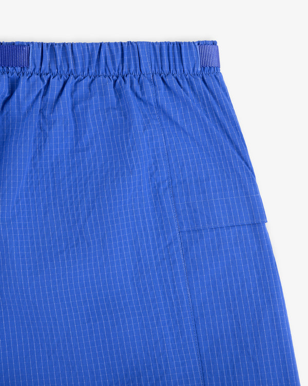 Close-up of Ripstop Nylon Wave Short in blue with an elastic waistband and subtle white pinstripes.