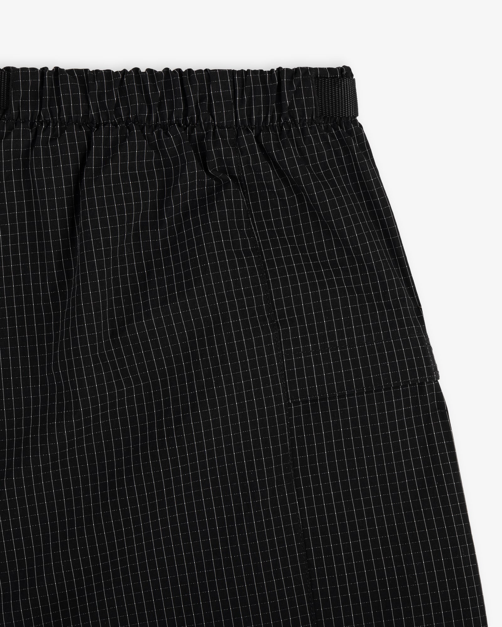 Close-up of Ripstop Nylon Wave Short with an elastic waistband and a subtle white grid pattern.