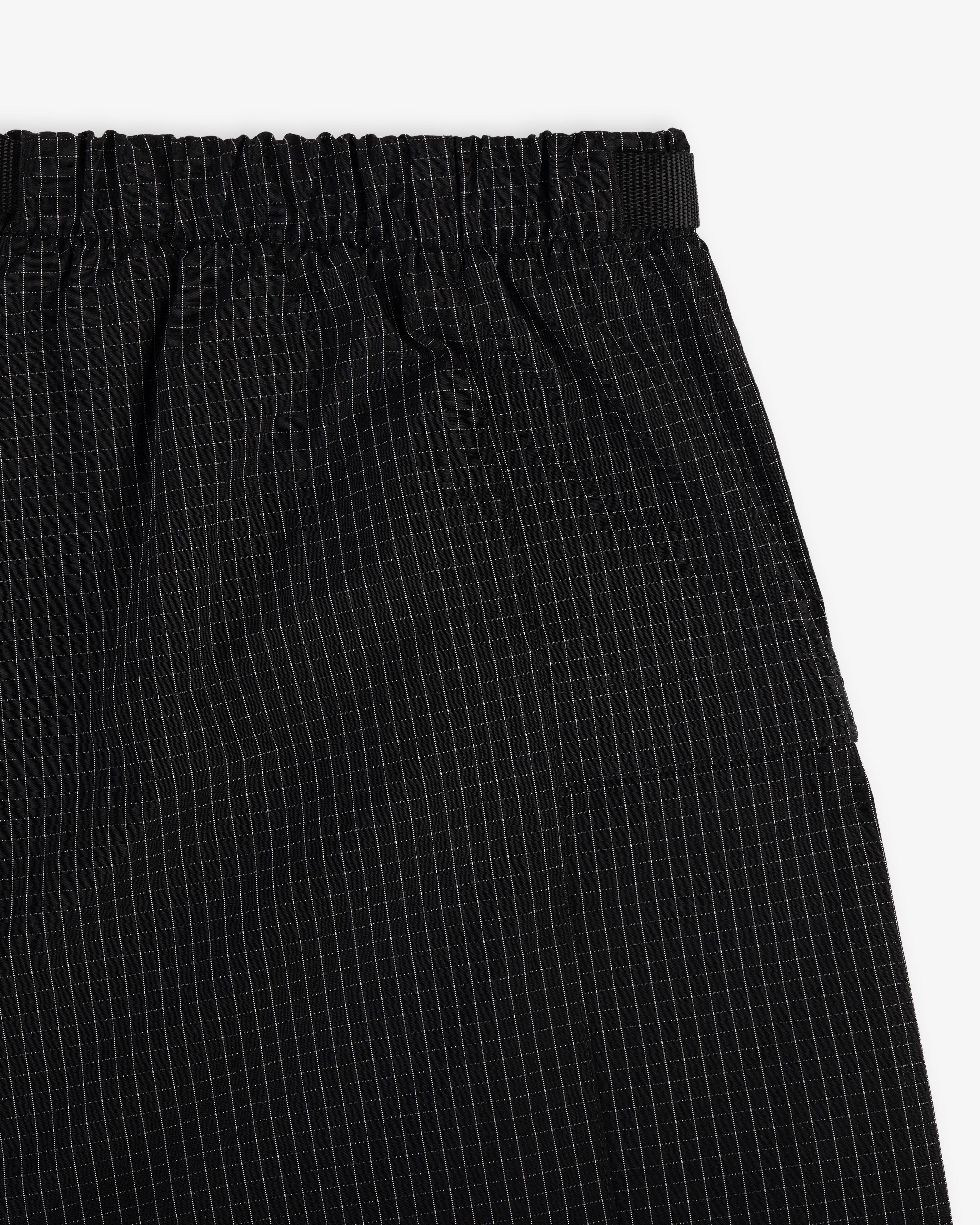 Close-up of Ripstop Nylon Wave Short with an elastic waistband and a subtle white grid pattern.