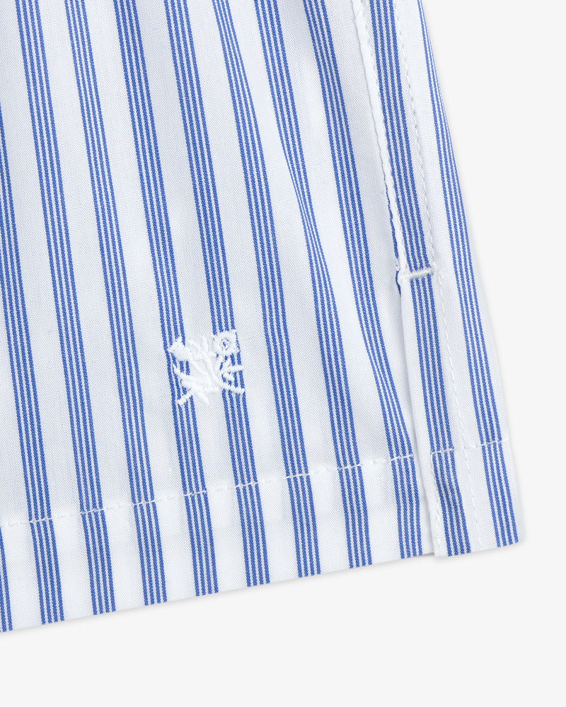 Close-up of Striped Boxer Short with blue and white vertical stripes and a small embroidered white crab near the hem.