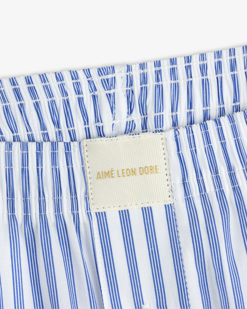 Close-up of blue and white Striped Boxer Short with a beige AIMÉ LEON DORE label on the waistband.