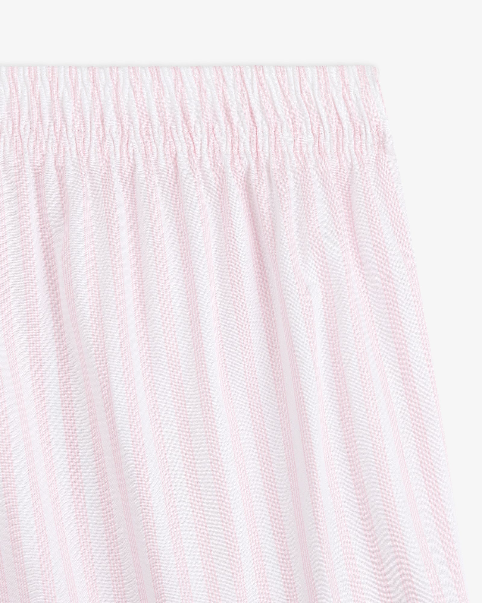 Close-up of the Striped Boxer Short featuring light pink and white vertical stripes and an elastic waistband.