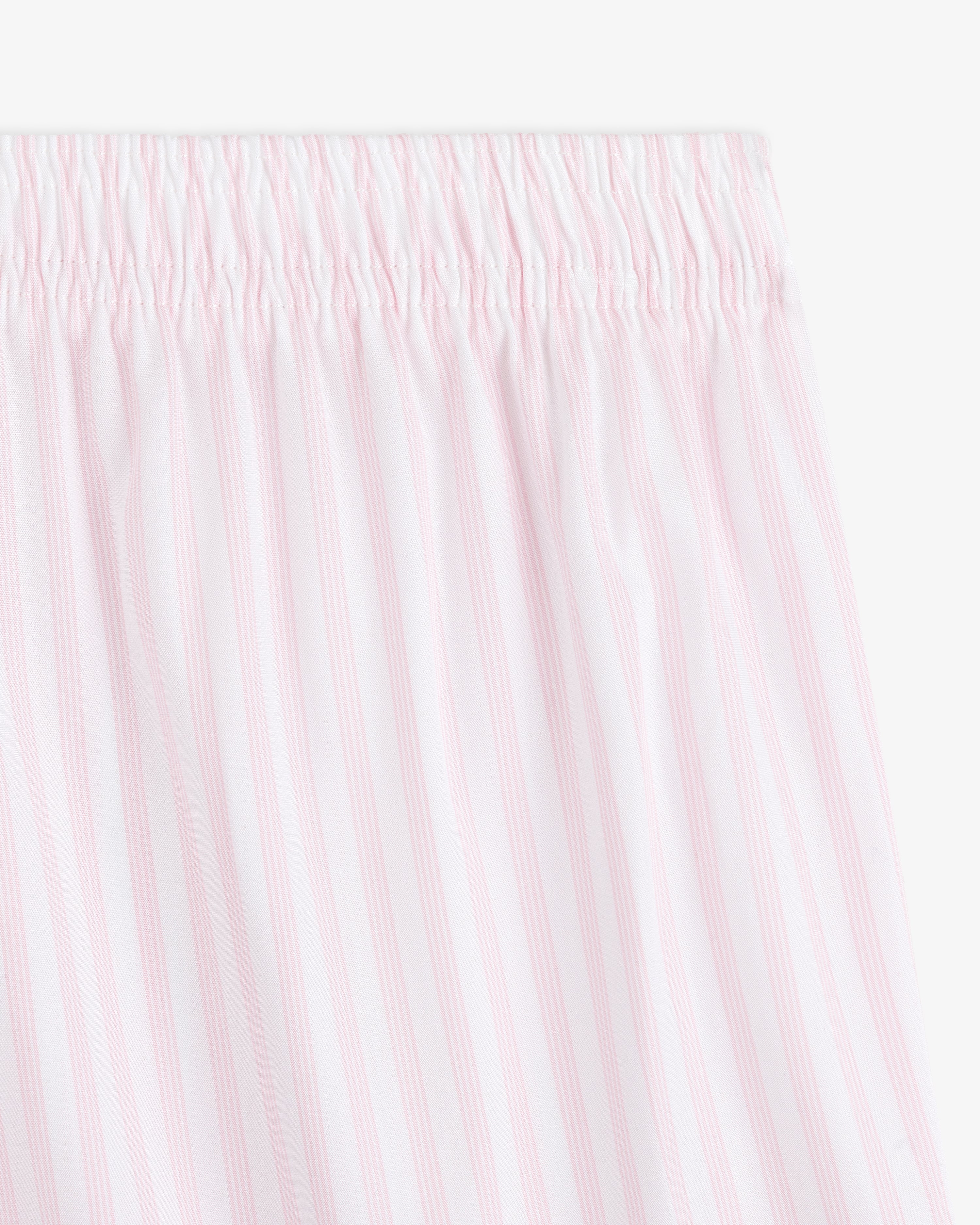 Close-up of the Striped Boxer Short featuring light pink and white vertical stripes and an elastic waistband.