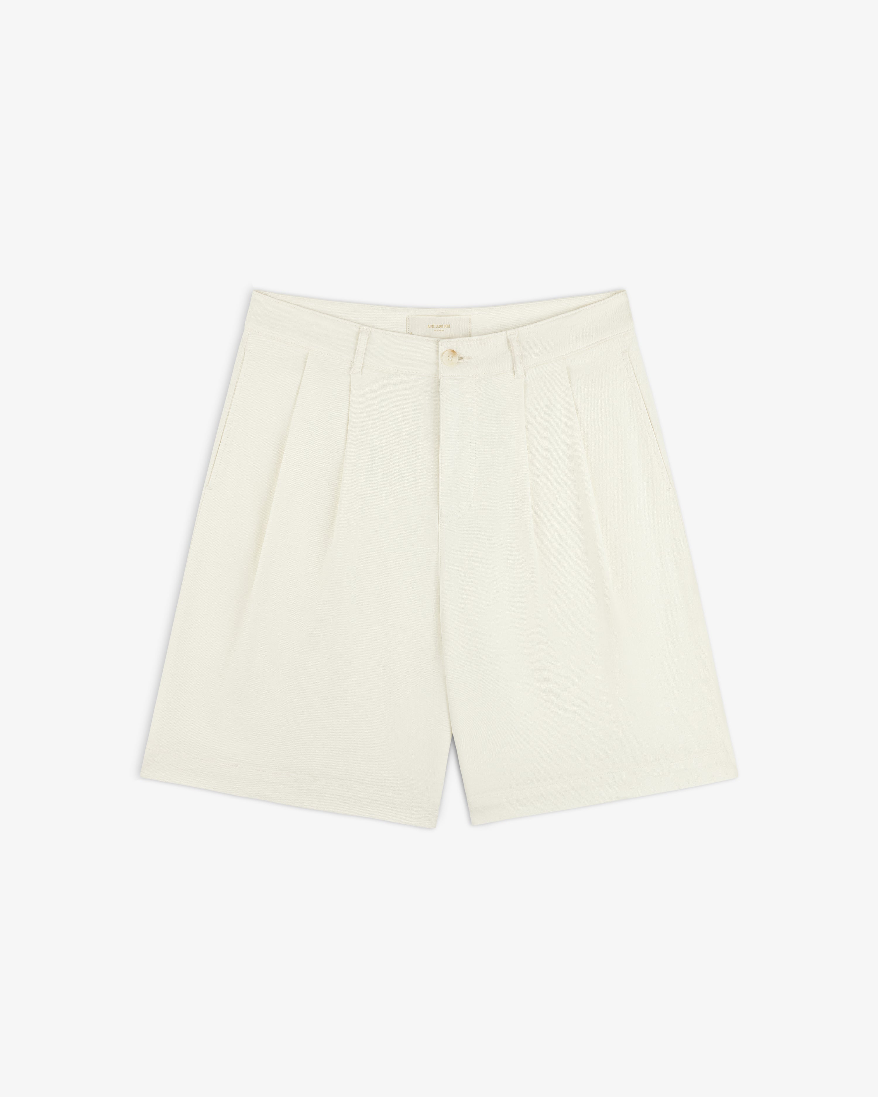 Cream Pleated Linen Blend Bermuda Shorts with slanted side pockets and button closure, shown on a white background.