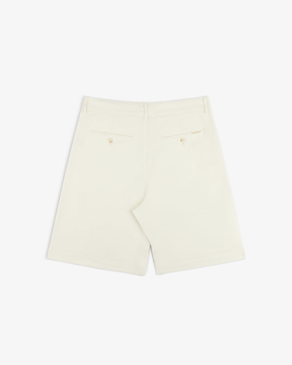 Back of Pleated Linen Blend Bermuda Short in cream, with two buttoned back pockets, shown on a white background.