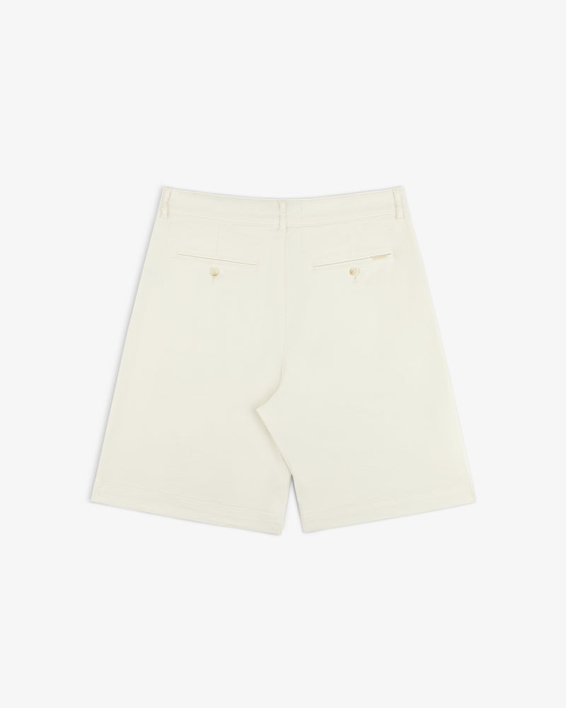 Back of Pleated Linen Blend Bermuda Short in cream, with two buttoned back pockets, shown on a white background.