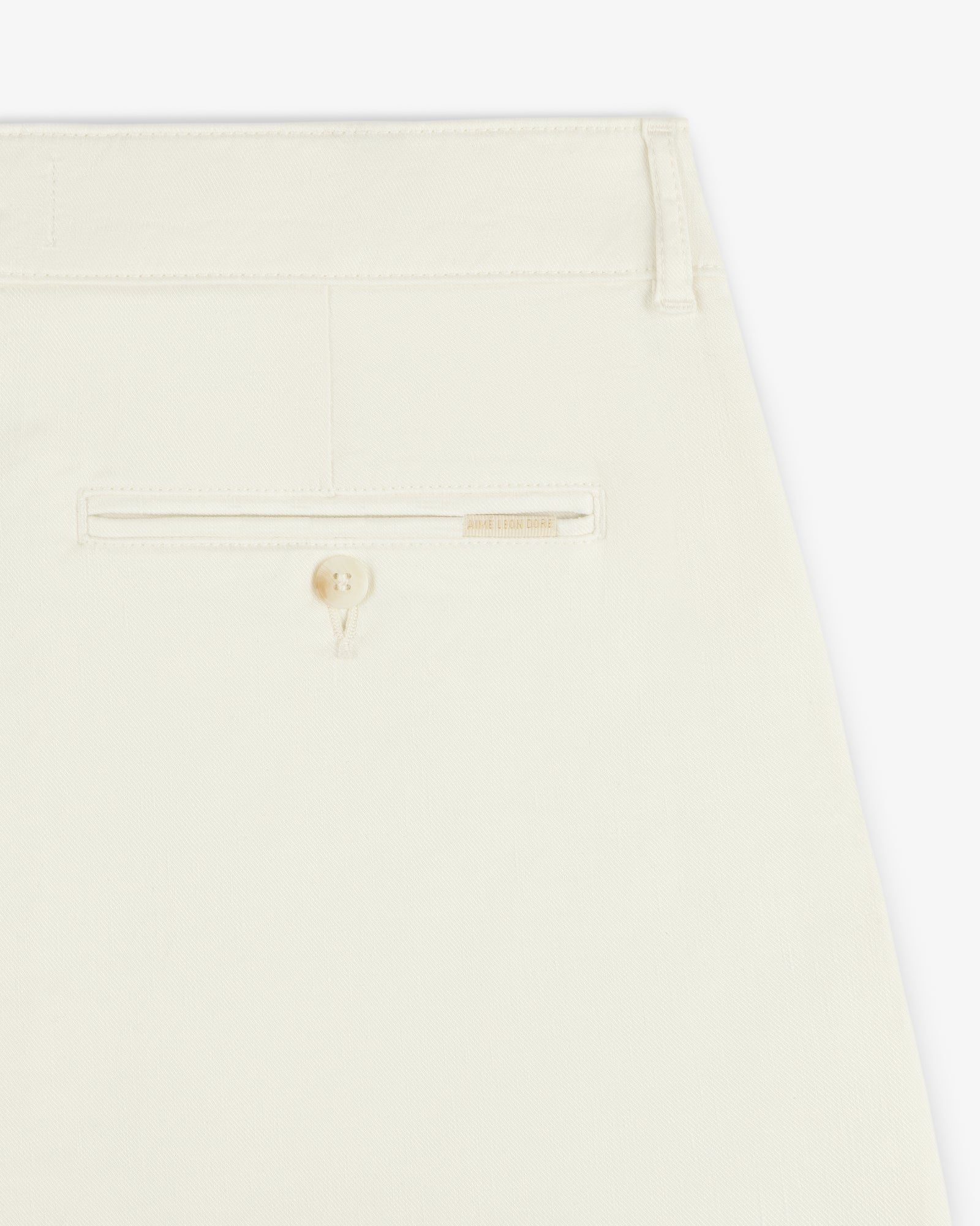 Close-up of the back pocket on the Pleated Linen Blend Bermuda Short, featuring a button and subtle stitching.
