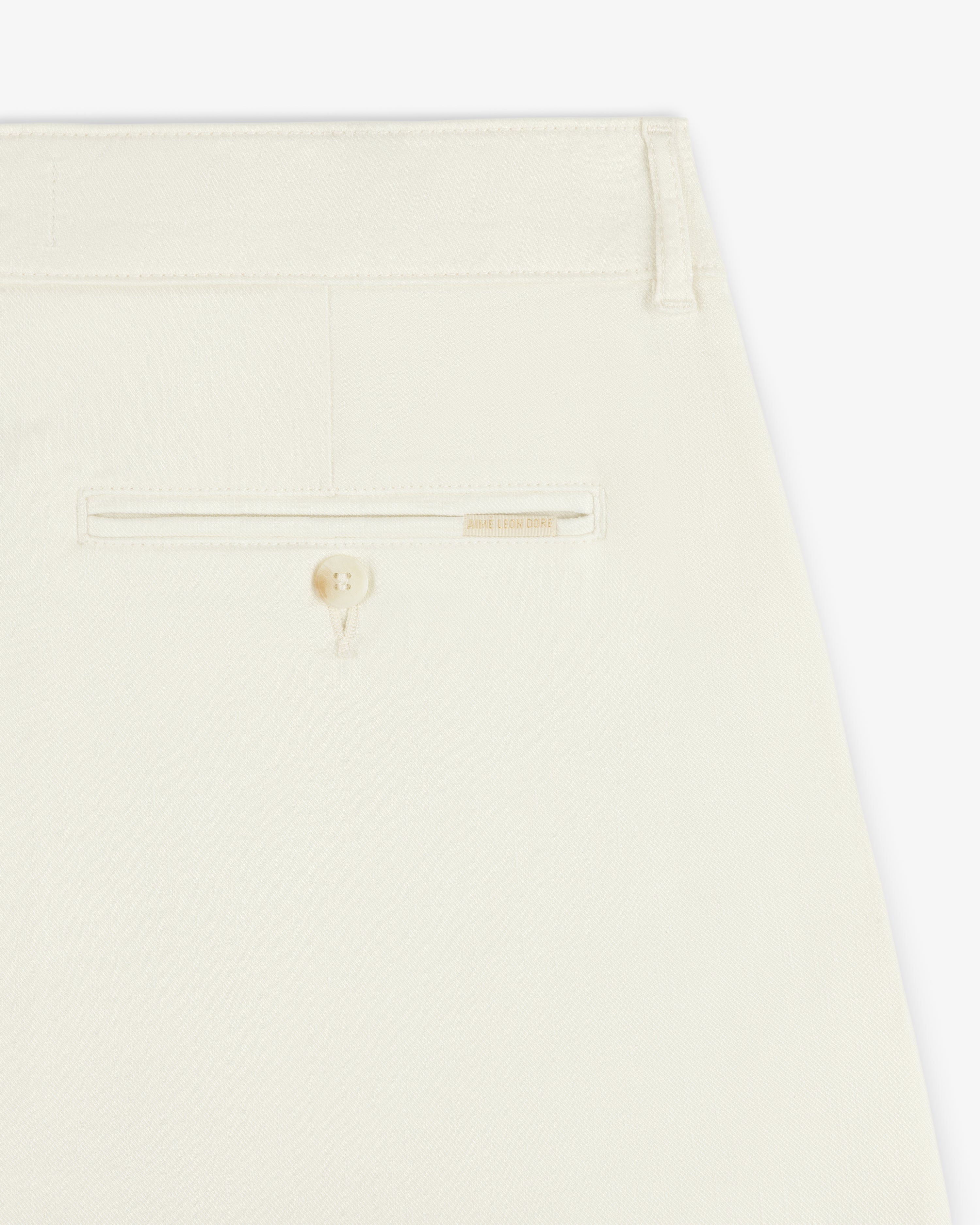 Close-up of the back pocket on the Pleated Linen Blend Bermuda Short, featuring a button and subtle stitching.