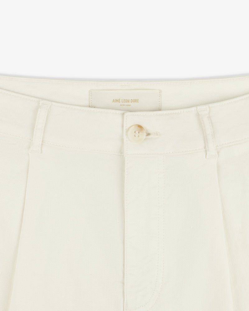 Close-up of Pleated Linen Blend Bermuda Short in cream with button closure, belt loops, and Aime Leon Dore label.