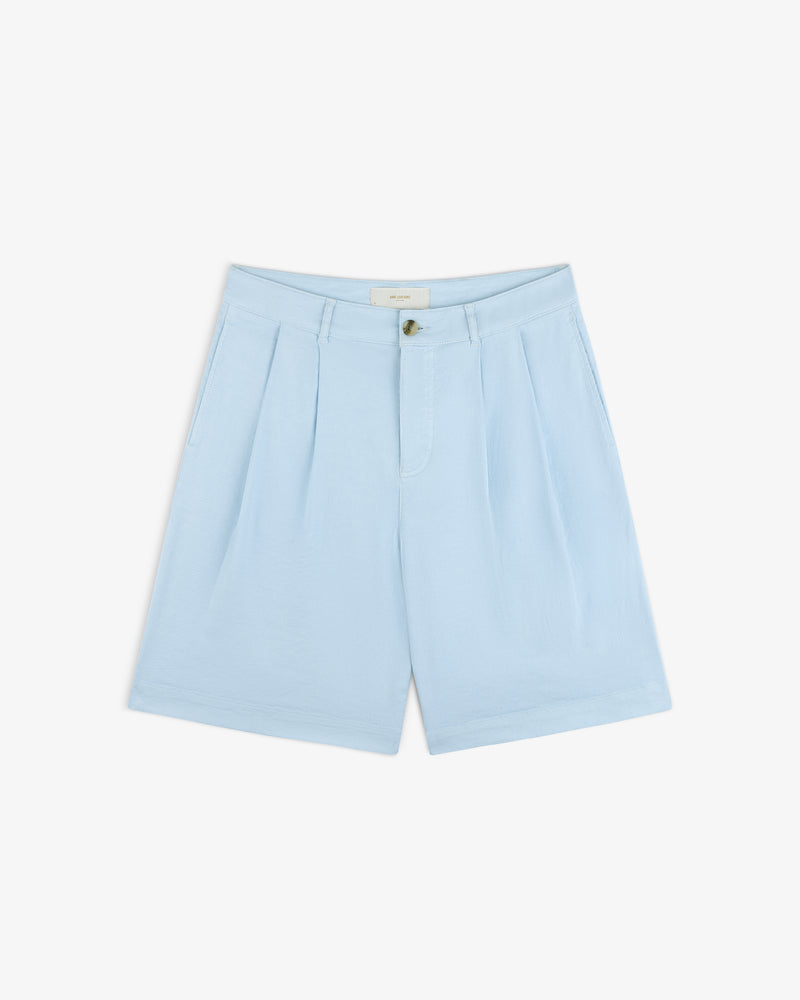 Light blue Pleated Linen Blend Bermuda Short with button and zipper, laid flat on a white background.