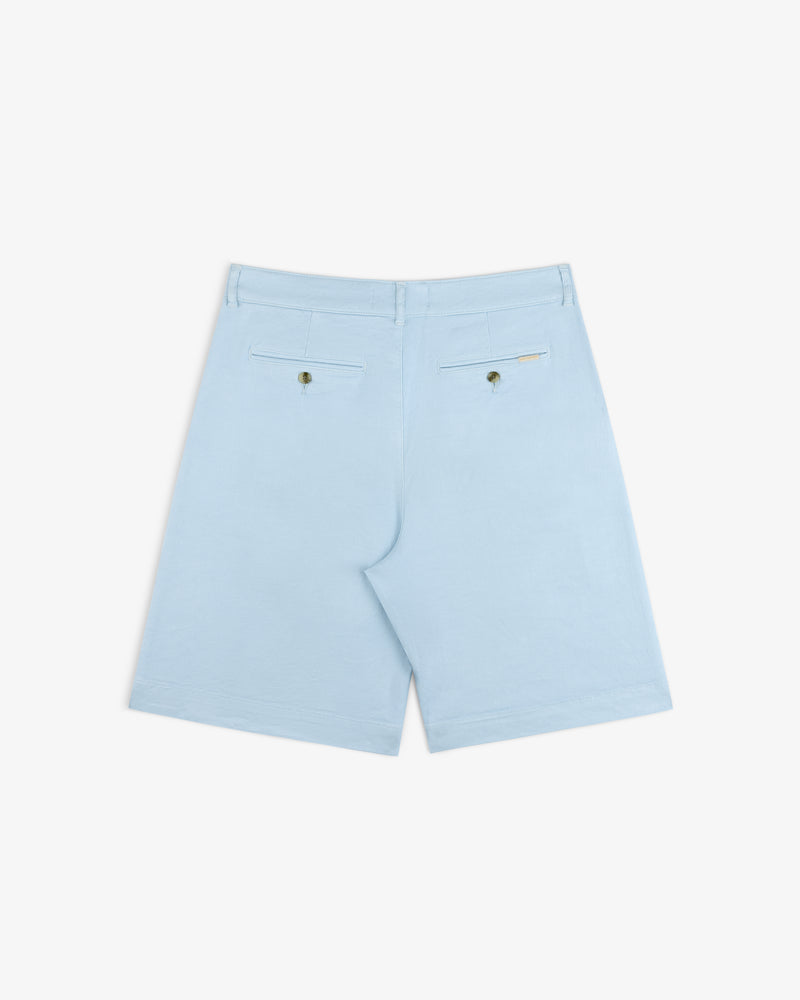 Pleated Linen Blend Bermuda Short in light blue, with two back pockets and button closures, shown on white background.