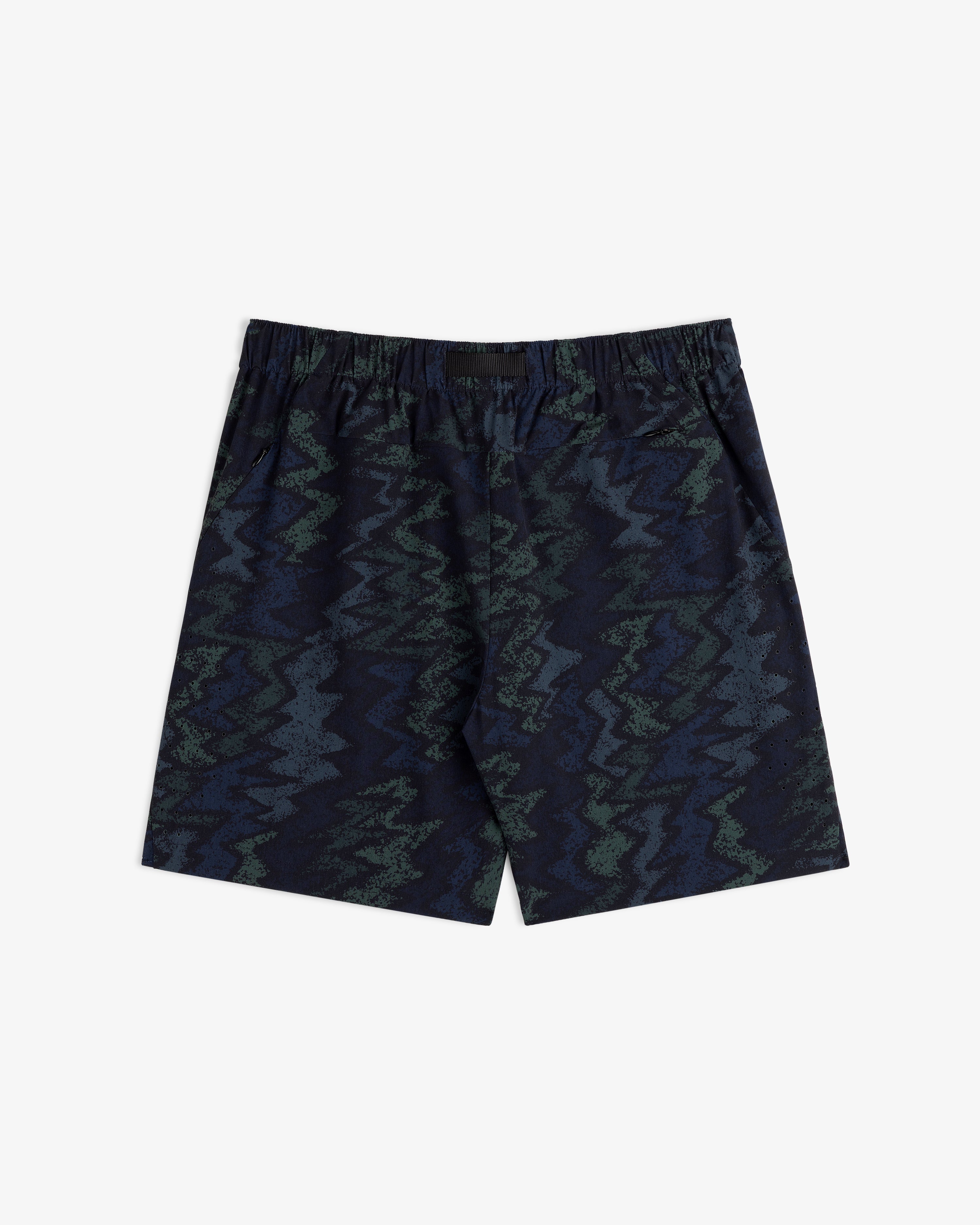 ALD Golf Performance Short in navy blue with an elastic waistband and green-blue zigzag abstract pattern.