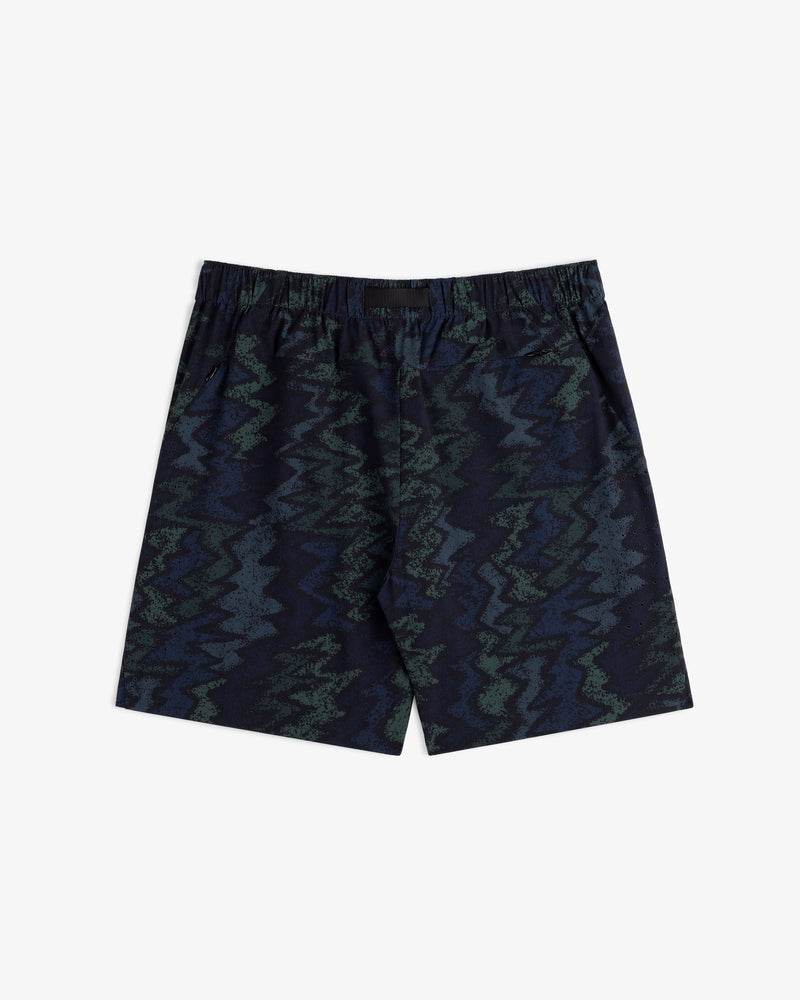 ALD Golf Performance Short in navy blue with an elastic waistband and green-blue zigzag abstract pattern.