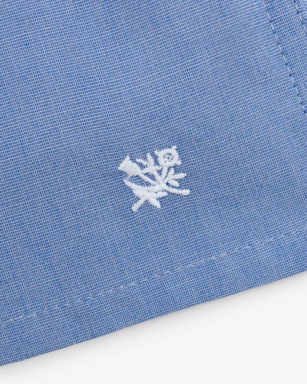 Close-up of Boxer Short 2-Pack in blue fabric with white embroidered floral design near the edge.