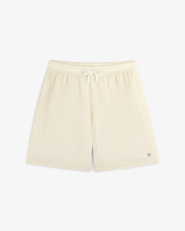Long Nylon Track Short in off-white with elastic waistband and drawstring, laid flat on a white background.