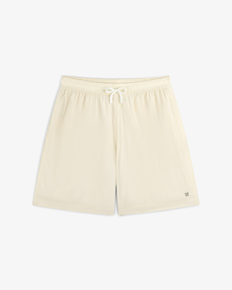 Long Nylon Track Short in off-white with elastic waistband and drawstring, laid flat on a white background.