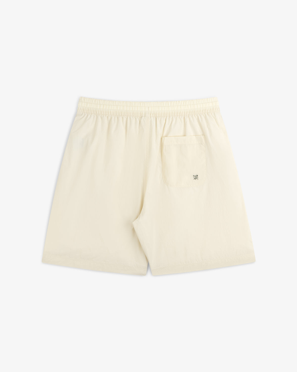 Back view of Long Nylon Track Short in cream, featuring an elastic waistband and a single right-side pocket.