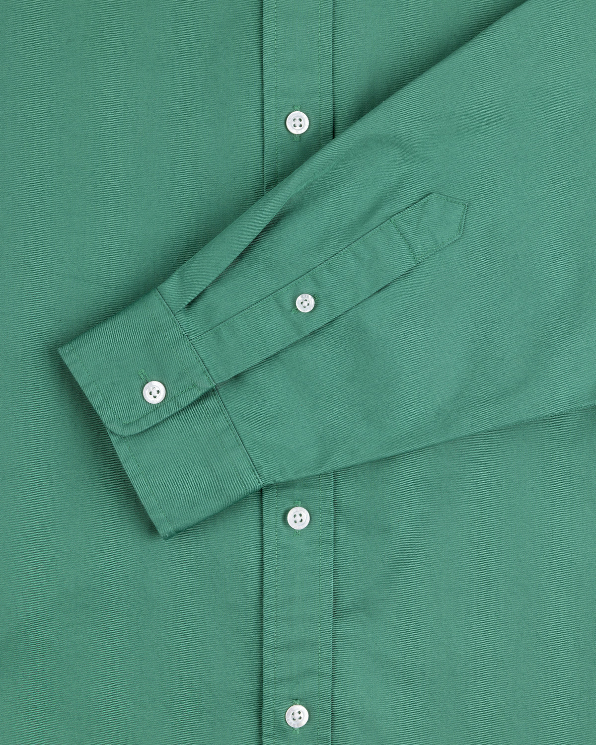 Leon Overshirt in green with white buttons, featuring a long-sleeve front and one folded sleeve.