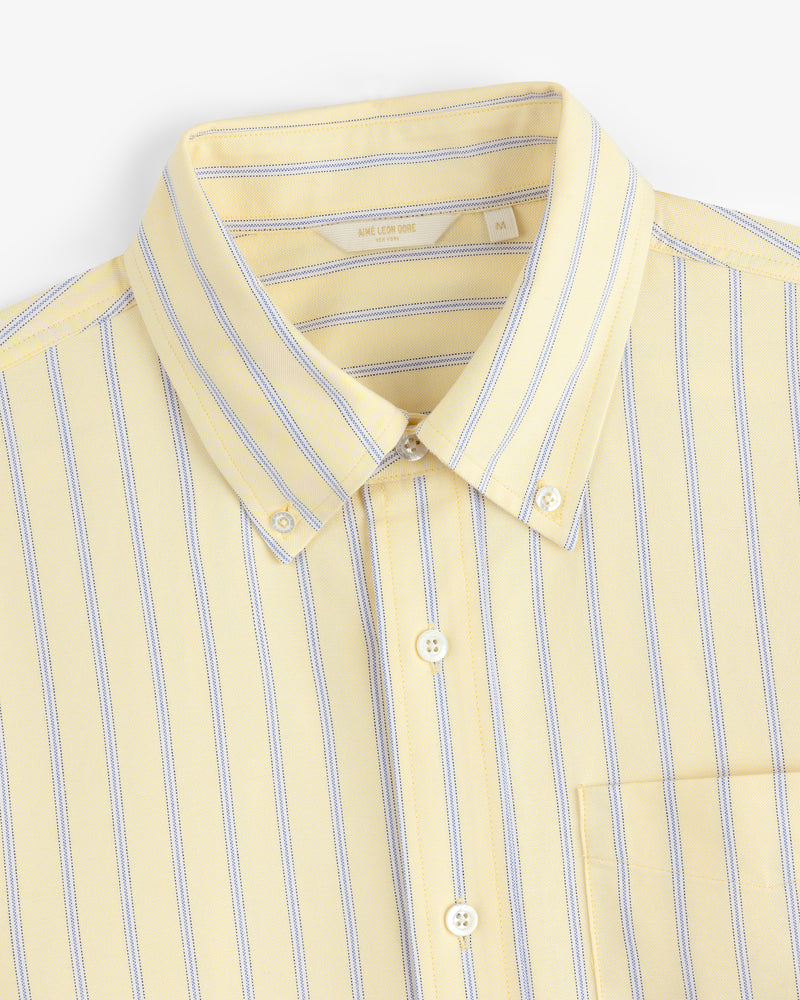 Yarn Dyed Striped Crest Shirt: yellow button-up with blue and white stripes, collar, and chest pocket.
