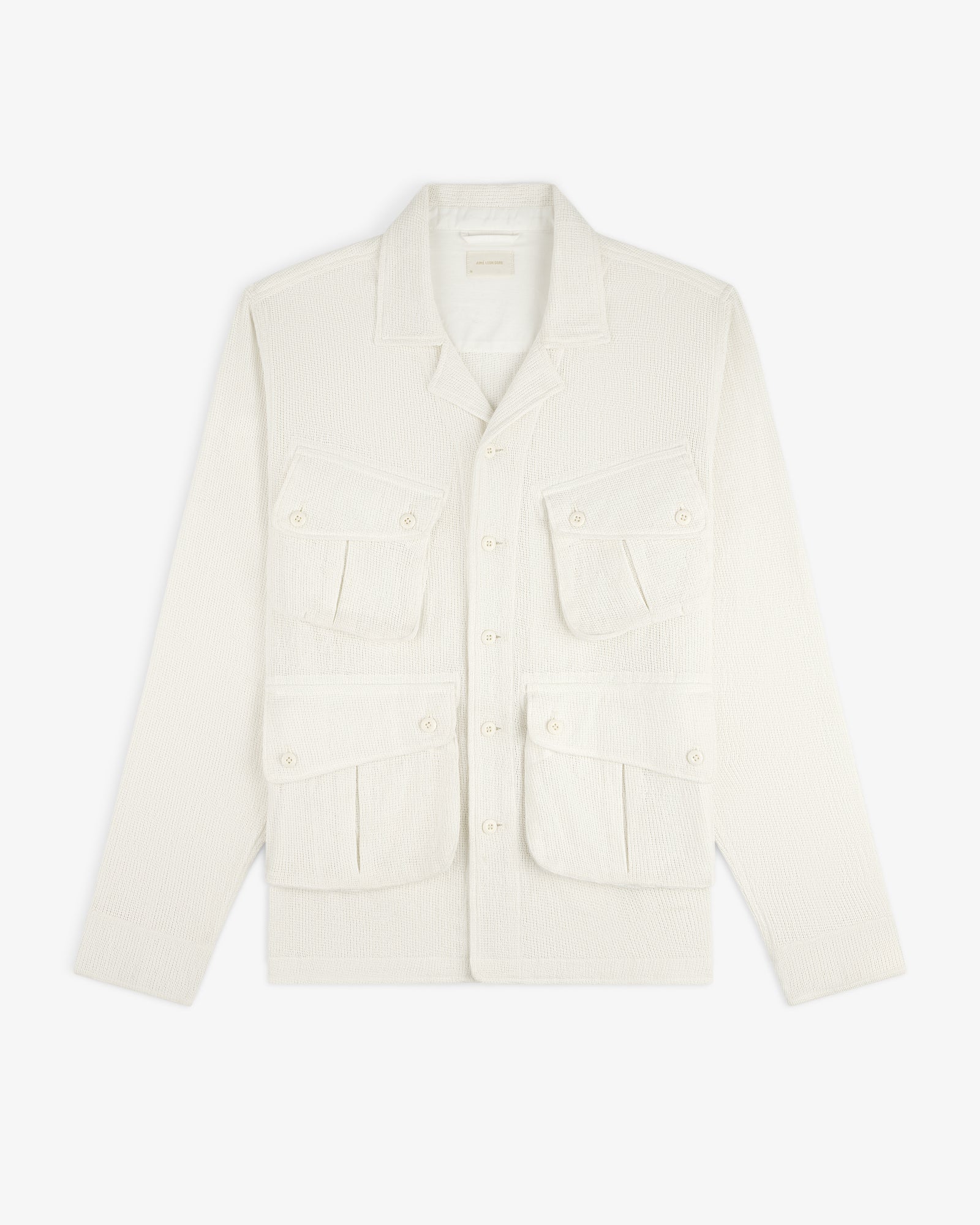 Mesh Jungle Shirt with collar and four front flap pockets, off-white and textured, laid flat on white background.