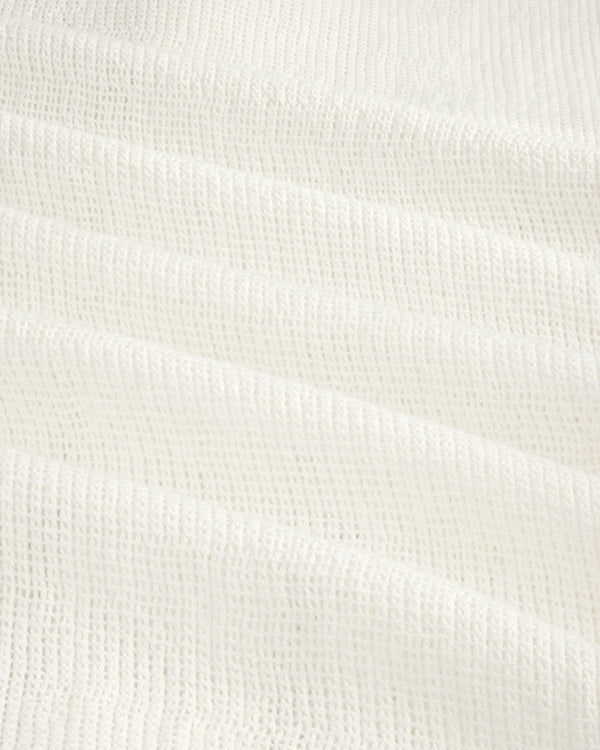 White textured waffle-weave fabric on the Mesh Jungle Shirt, shown in soft, gentle folds.