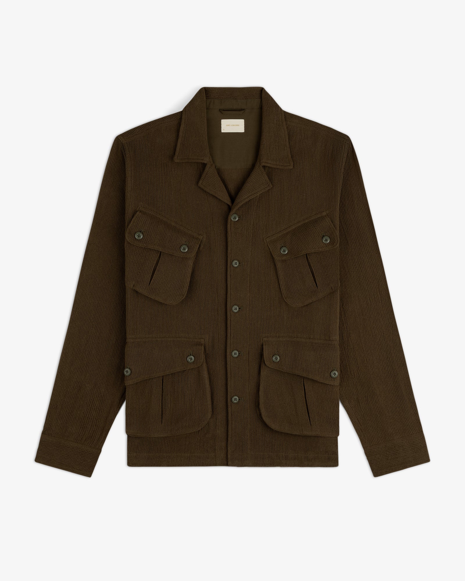 Mesh Jungle Shirt in dark brown, button-up, with four front flap pockets, displayed on a white background.