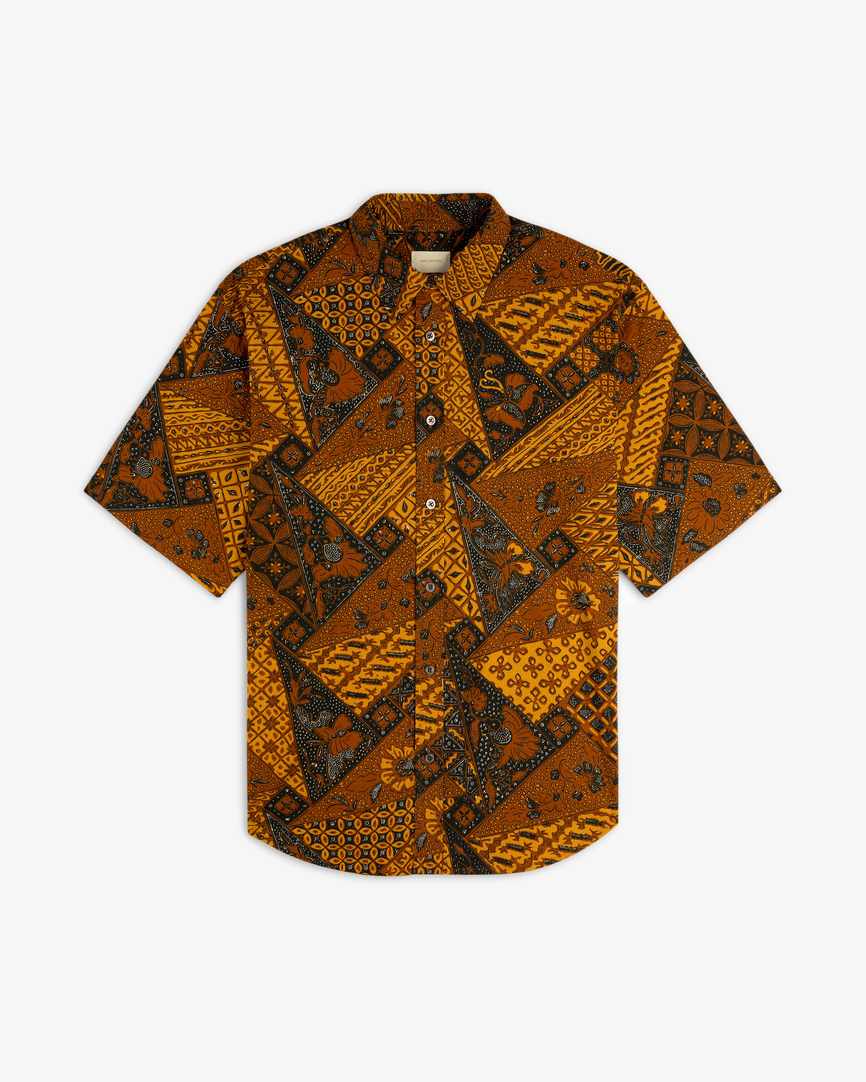 Printed Abstract Shirt with a brown, black, and yellow geometric floral batik pattern and short sleeves.