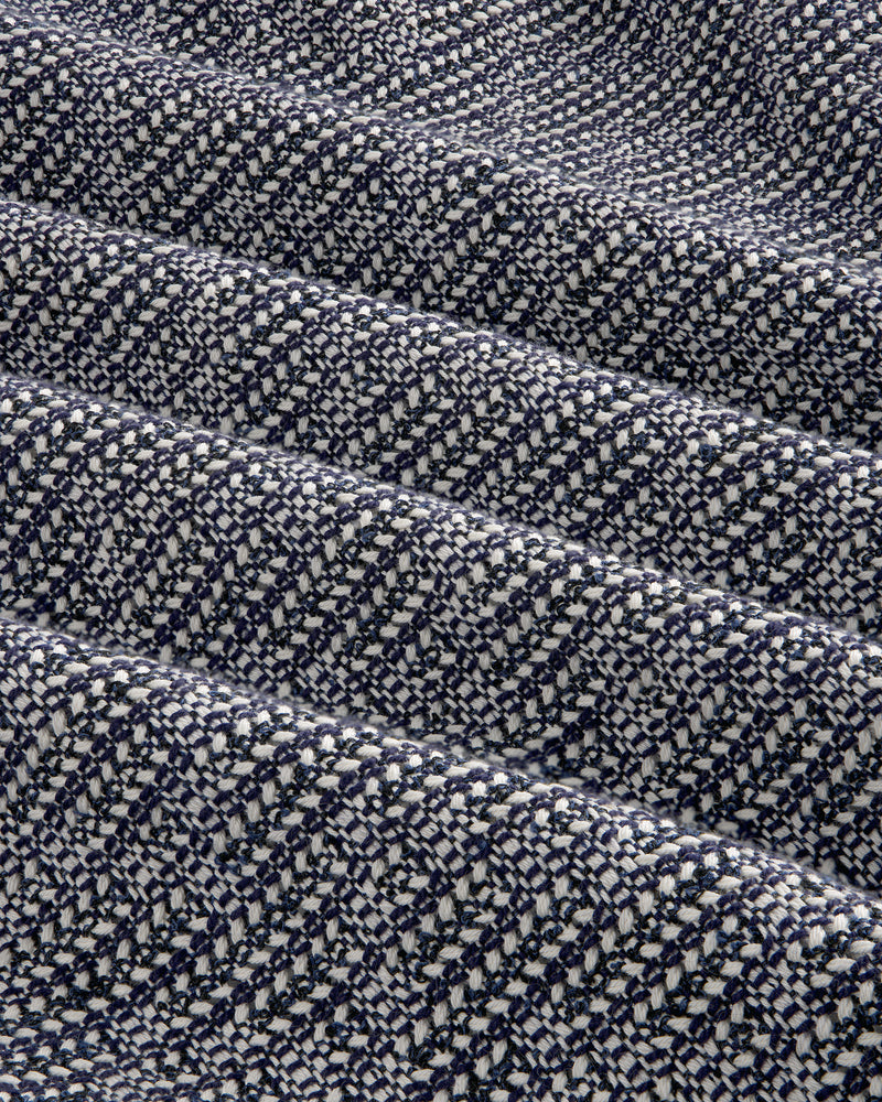 Close-up of the Textured Zip Shirt in navy blue and white woven fabric with a diagonal checkered pattern.