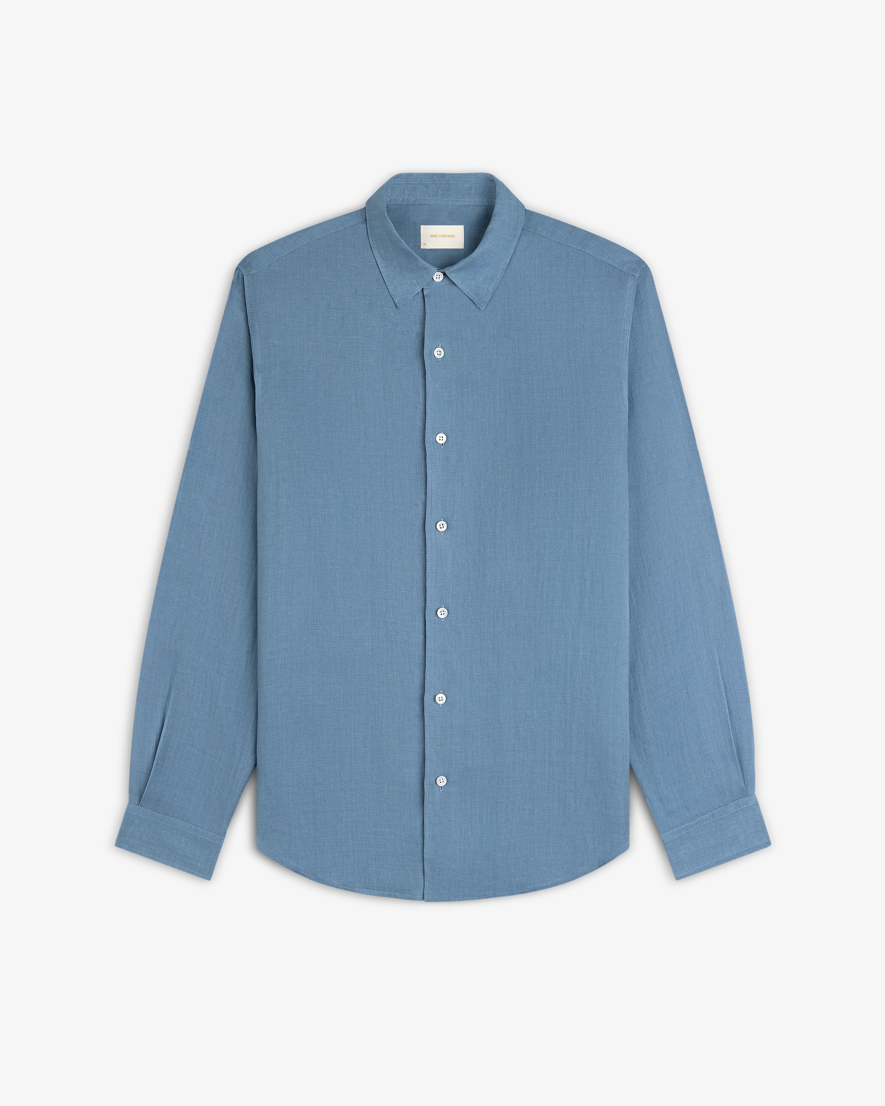 A Long-Sleeve Linen Shirt in light blue with a collar, button-up style, laid flat on a white background.