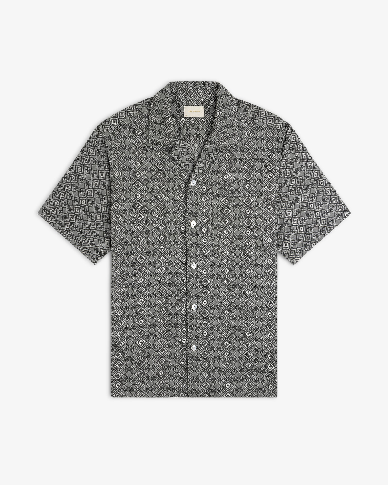Jacquard Leisure Shirt with short sleeves and a black and white geometric diamond pattern, laid flat on white.