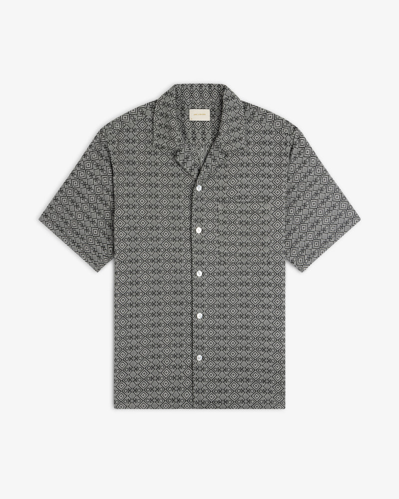Jacquard Leisure Shirt with short sleeves and a black and white geometric diamond pattern, laid flat on white.